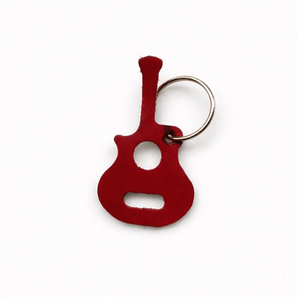 Red guitar-shaped keychain on a white background